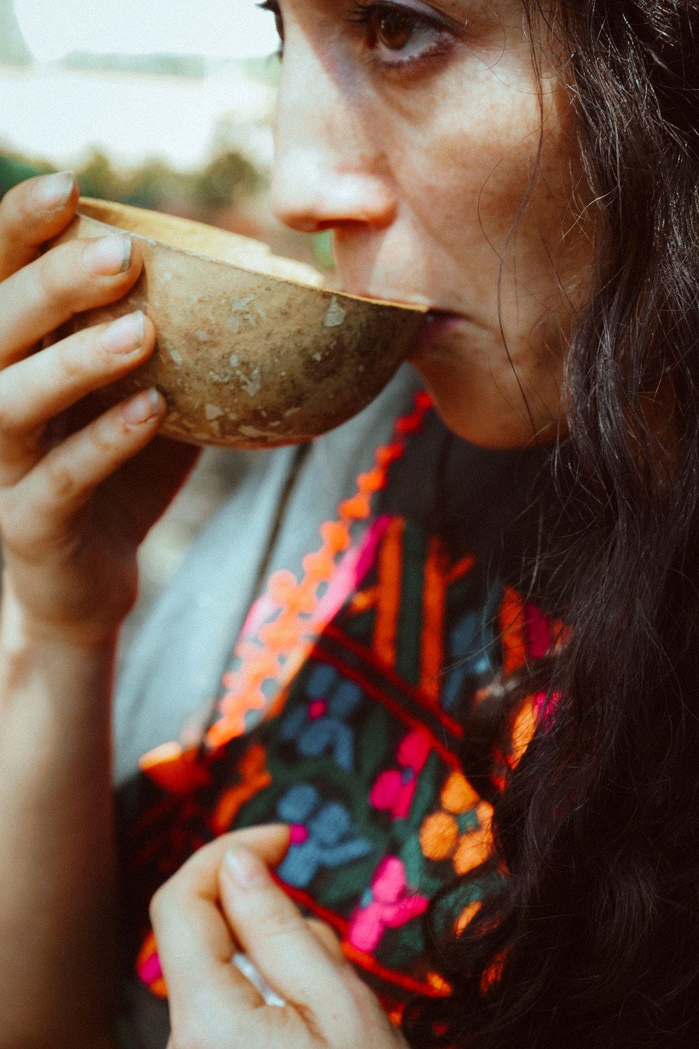 Eréndira drinking cacao from a jicara